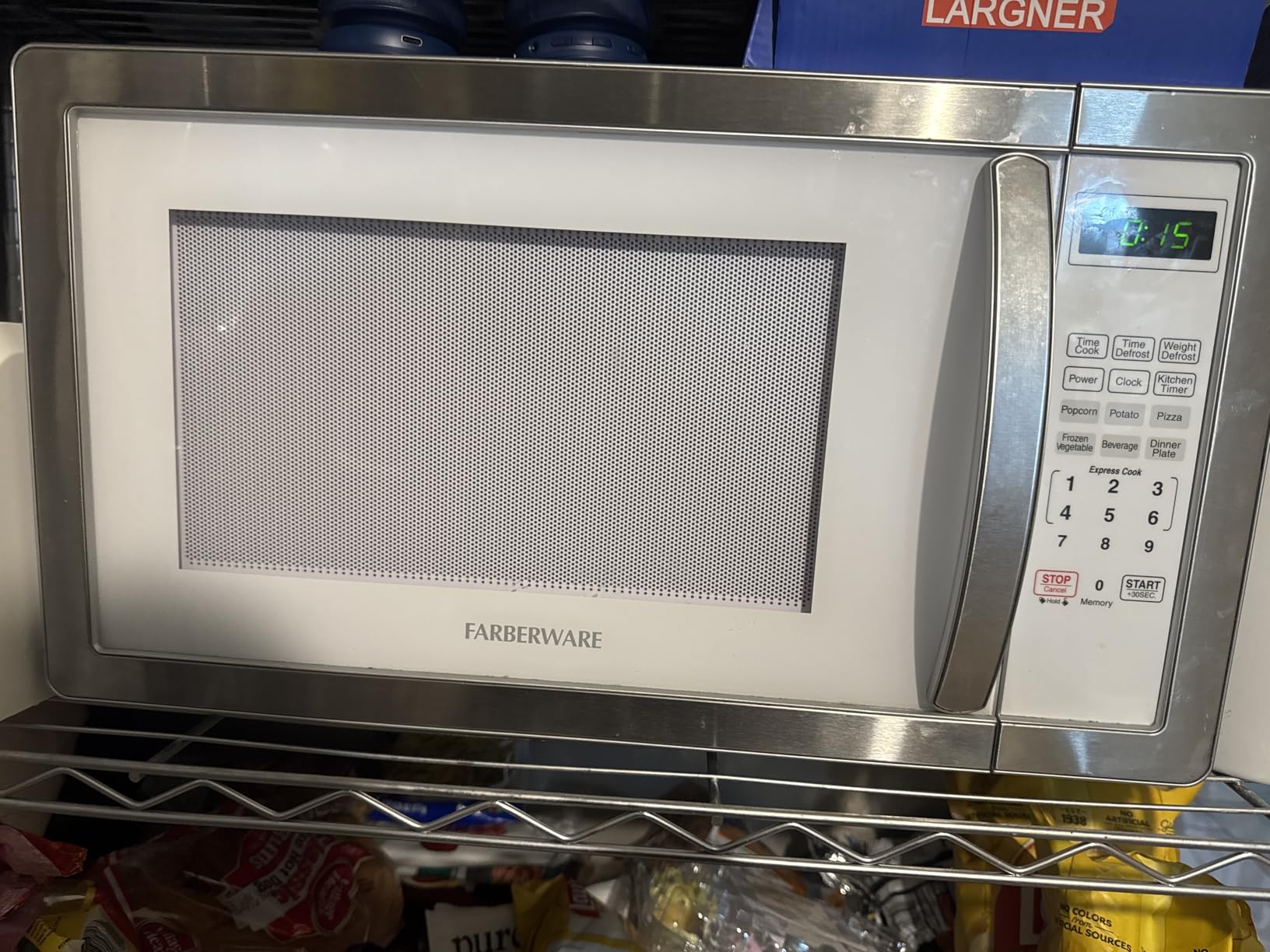 Farberware 0.7 Cu. Ft. Countertop Microwave Oven - 700 Watts Power, Auto Cook Settings, Defrost, Easy Clean and Child Safety Lock - Stainless customer photo 2