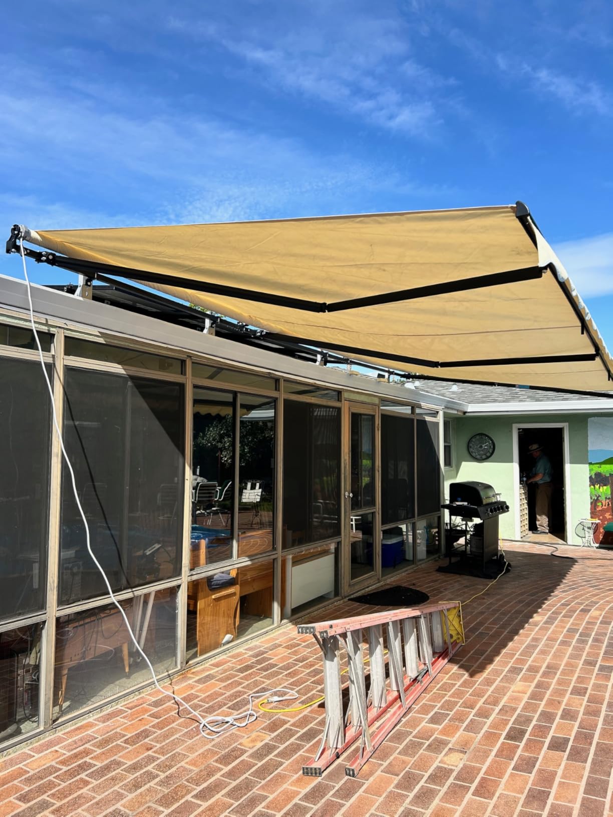 Aleko 16x10 feet Caribbean Style Electric Black Frame Awning, Remote Control Motorized & Manual Crank, Outdoor Shade Canopy with UV-Resistant Fabric - Desert Sand customer photo 2