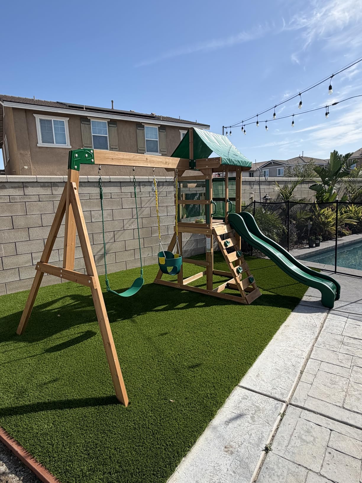 Backyard Discovery Bay Pointe Cedar Wood Swing Set with Wave Slide, Play Deck, Rock Wall Ladder, Belt Swings, Chalkboard, Canopy Roof, Outdoor Playset customer photo 2